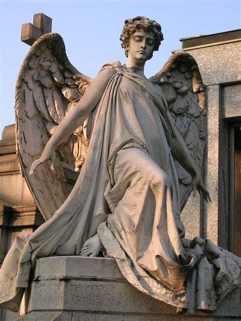 Sculpture On A Gravestone In The Monumental Cemetery In Milan Angel