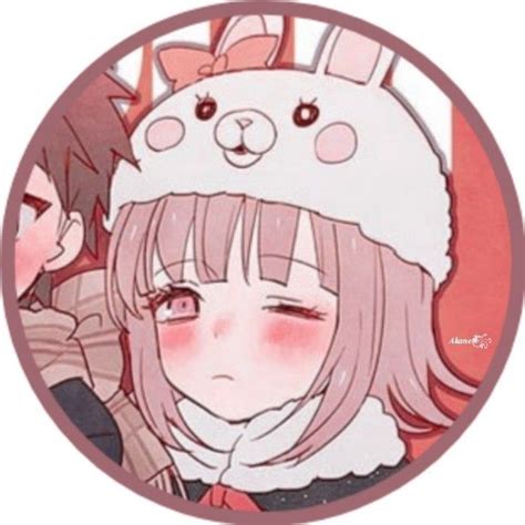 An Anime Character With Pink Hair Wearing A Bunny Ears Hat And Holding