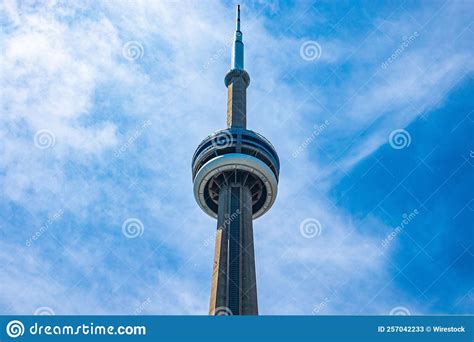 Partial Shot Of The Cn Tower Under Blue Cloudy Sky Editorial Stock