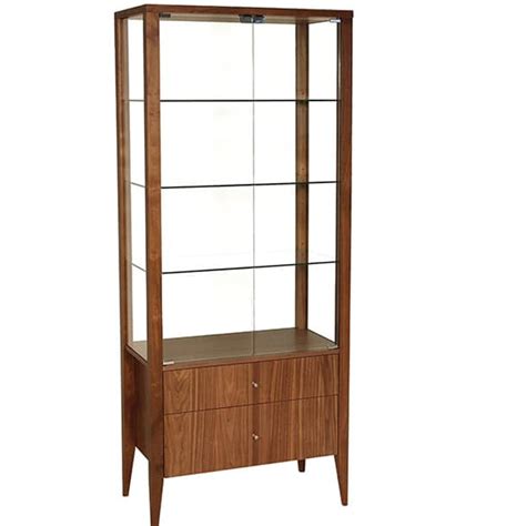 A china cabinet's bulkiness and elegance make it an immediate standout in a dining room and an a curio cabinet can stand as a formal piece of furniture in a dining room, den or front entrance of a home. Alex Display Cabinet - Fanny's Furniture Kelowna, BC