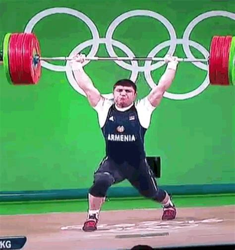 Watch An Olympic Weightlifters Elbow Snap