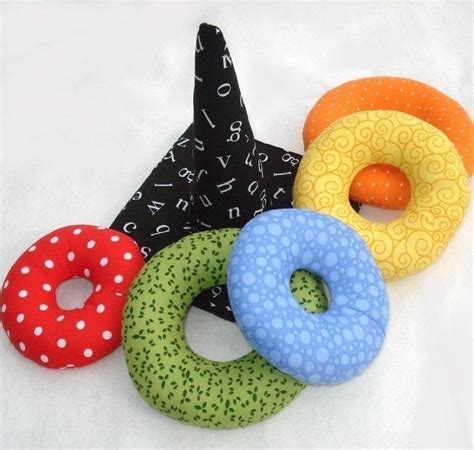 Four Different Types Of Donuts On A White Surface With Polka Dots And