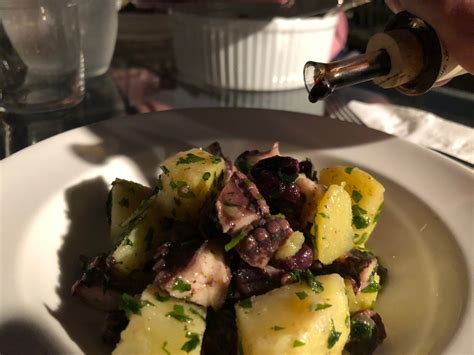 Boiled octopus or octopus salad. Octopus salad with traditional balsamic vinegar