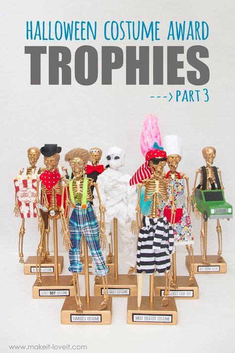 Halloween Costume Award Trophies With Skeleton Figurines On Wooden
