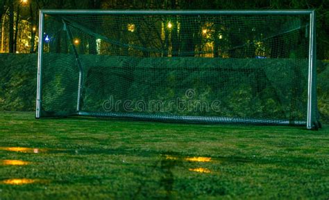 Football Gate On The Pitch With Artificial Turf At Night Stock Photo