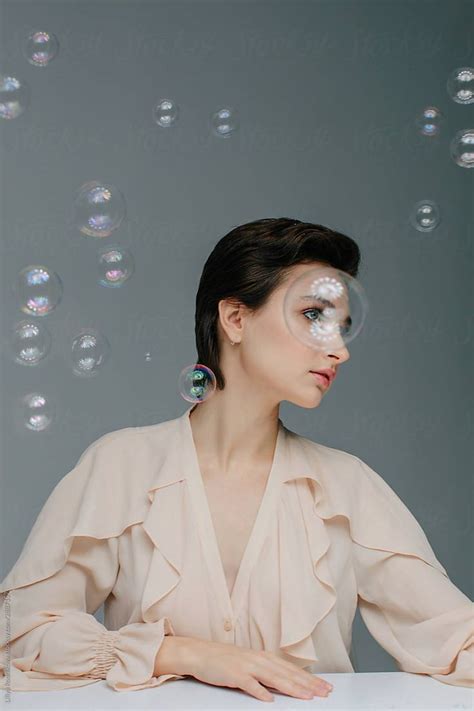 Charming Woman Behind The Soap Bubbles By Stocksy Contributor Liliya
