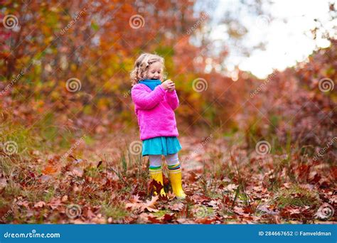 Kids Play In Autumn Park Children In Fall Forest Stock Photo Image