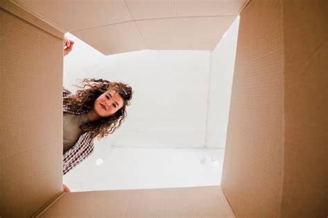 Free Photo Woman Looking Inside Box