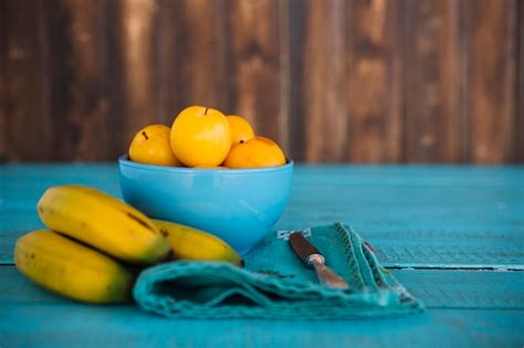 Free Photo Bananas Ad Fresh Plums On Blue Wooden Surface