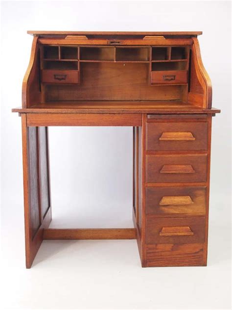 This compact writing desk is the perfect solution for all your personal workspace needs. Small Oak Roll Top Desk