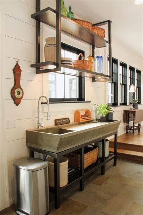 The modern kitchen is the heart of the home. Potting Room / Mudroom / Breezeway. Custom concrete sink ...