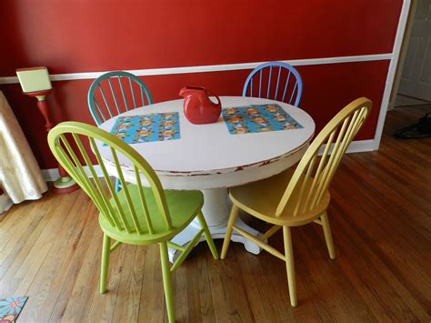 Farmhouse kitchen tables generally constructed from oak woods. colorful, painted chairs, multicolored chairs, kitchen ...