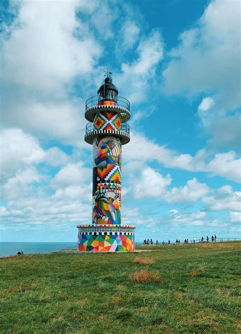 Multi Color Lighthouse Under The Blue Sky · Free Stock Photo