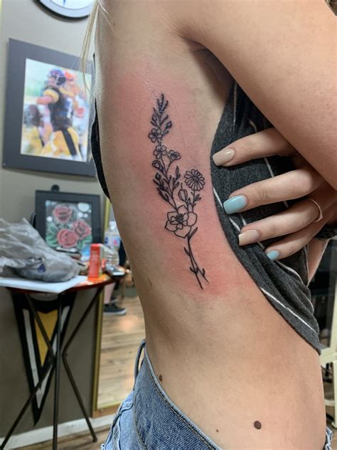 It allows you to vary the size of the painting, which gives space for small women tattoos and for the volume male pattern. Rib cage flower tattoo. Larkspur and Daisy's - Modern