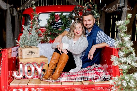 Couple Christmas Mini Session In The Bed Of An Old Vintage Red Chevy