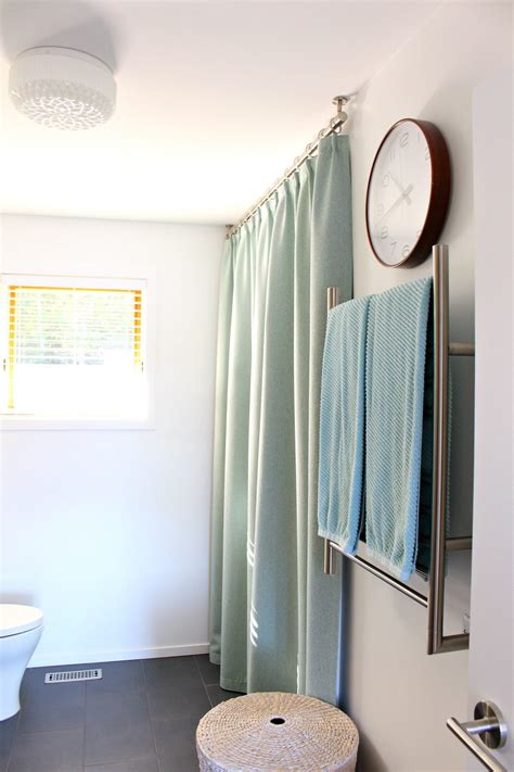 How to hang curtains from the ceiling. Bathroom Update: Ceiling Mounted Shower Curtain Rod ...