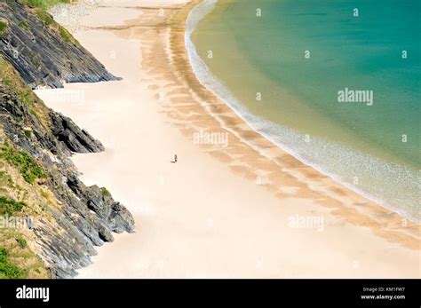 Woman Walking On Deserted Silver Strand Beach At Malin Beg Glencolumbkille County Donegal