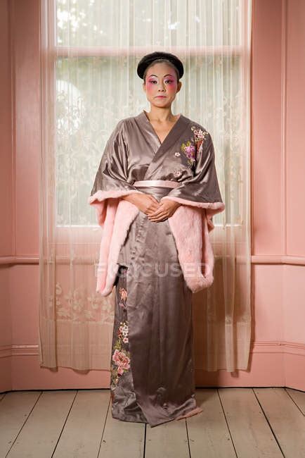 Japanese Woman Wearing Kimono At Home House Interior Full Length Stock Photo