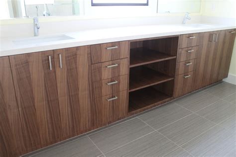 Simply choose a kitchen cabinet then put a vanity tops on it to transform it into a bathroom vanity cabinet. Walnut IKEA Bathroom - Contemporary - Bathroom - los angeles - by Semihandmade