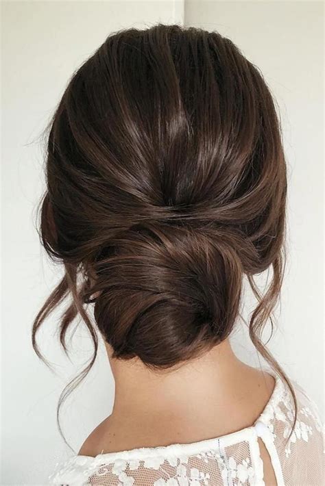If you are planning to do a lot of dancing. wedding hairstyles for long hair low simple bun on dark ...