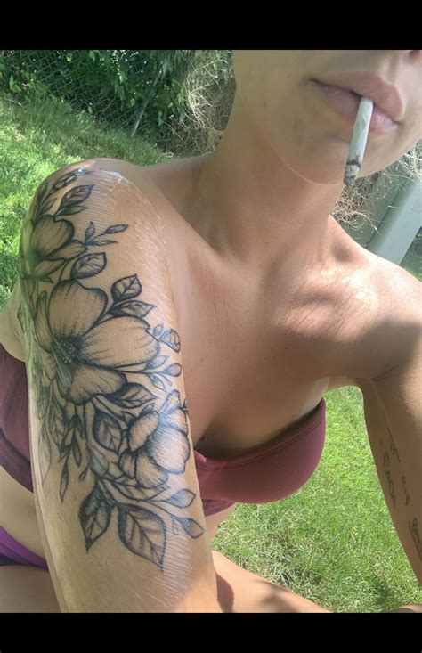 This is one tattoo design that is made better because of the leaves with the flower. Floral arm sleeve shoulder tattoo flowers black and white ...