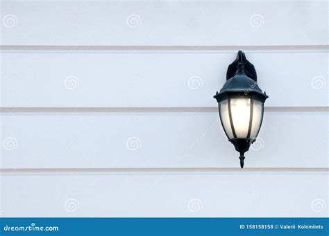 Glowing Old Street Lamp On The Wall Stock Photo Image Of