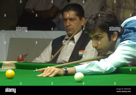 Indias Pankaj Advani Eyes The Ball To Play A Shot As Geet Sethi Left Looks On During The
