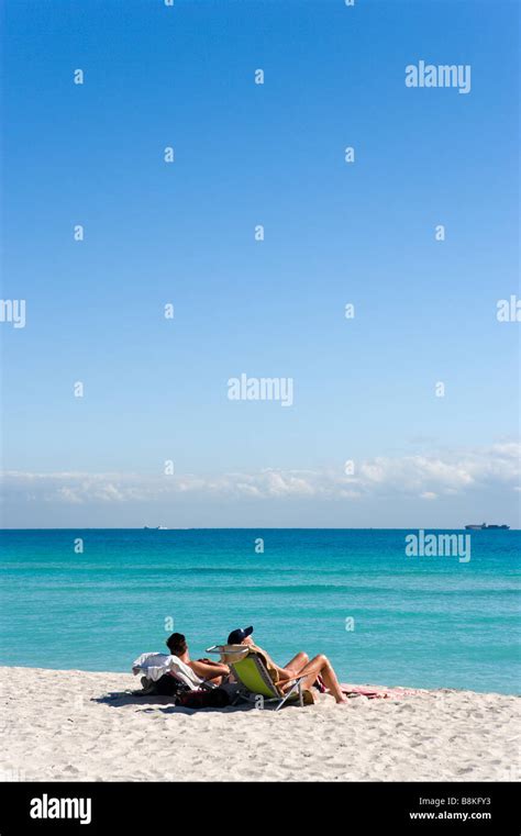 Two Men Sunbathing On South Beach Miami Beach Gold Coast Florida