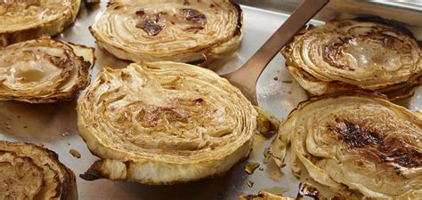 2 hispi cabbages, 100g of salted butter, softened, 30g of white miso, 1 small garlic clove, finely grated, 1 pinch of chilli flakes, (optional), 3 tbsp of white sesame seeds, toasted, 2 tbsp of rice vinegar, 1/2 tbsp of tamari, 1/2 tsp sugar, 1/2 tsp mirin, 1/2 tsp sesame oil. Oven Roasted Cabbage | MakeGood