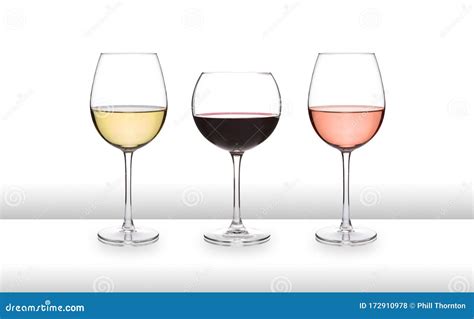 Three Glasses Of Wine White Red And Rose On A White Bar Like Surface