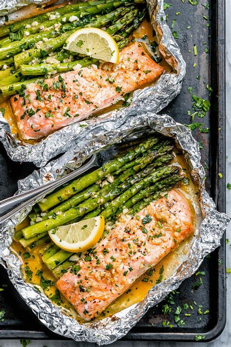 Place a salmon fillet, oiled side down, atop a sheet of foil. Baked Salmon in Foil Packs with Asparagus and Garlic ...