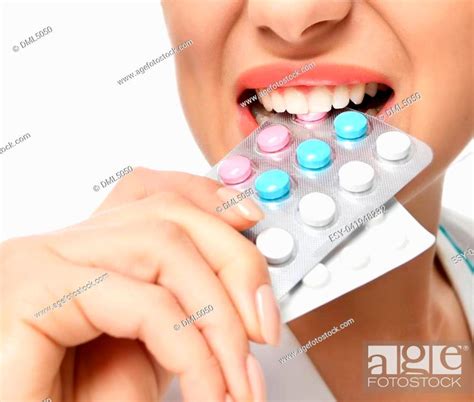 Female Doctor Bite Pack Of Pills Capsules Blue To The Patient In Hand Isolated On A White