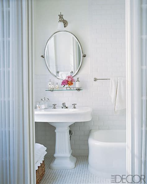 For the ultimate in design and practicality, go with a single long shelf that can hold towels for classy glassy organizer. Glass Shelf over Sink - Traditional - bathroom - Elle Decor
