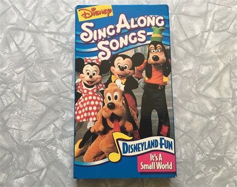 The Dvd Cover For Disney S Sing Along Songs Is Displayed On A White Surface