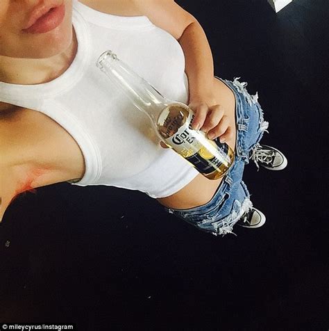 Miley Cyrus Strips Down To Show Off Her Bright Pink Arm Pit Hair On