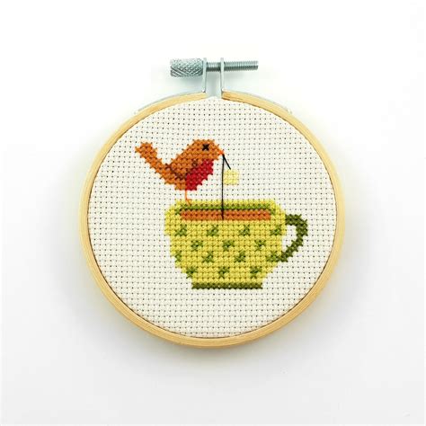 robin-on-tea-cup-cross-stitch-ringcat-design-cross-stitch-patterns,-tiny-cross-stitch