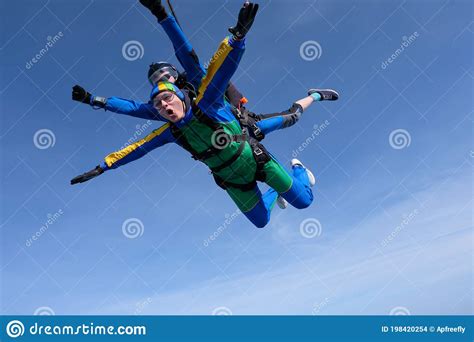 Skydiving Tandem Jump Two Skydivers Are Flying In The Sky Stock Photo