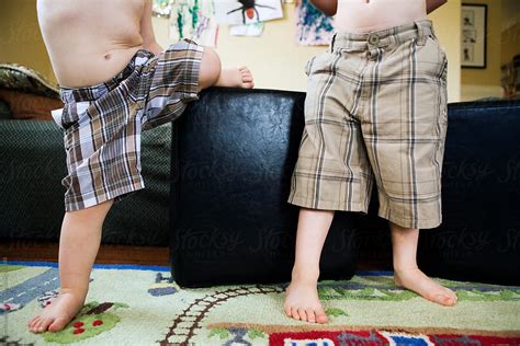Lower Torsos Of Two Boys In Plaid Shorts No Shirt By Stocksy