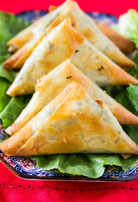 Take one end of the samosa and make a cone shape. Baked Spinach and Cheese Samosa | I Knead to Eat