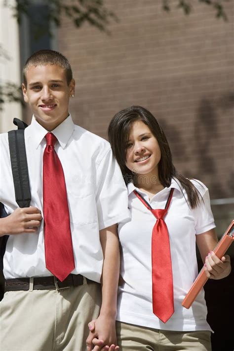 High School Couple In Uniform Holding Hands Stock Image Image 29663265