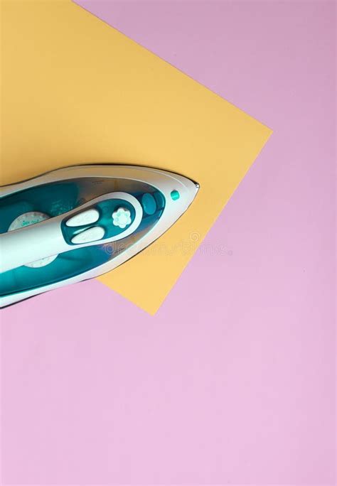 Iron For Ironing On A Colored Pastel Background Top View Minimalism