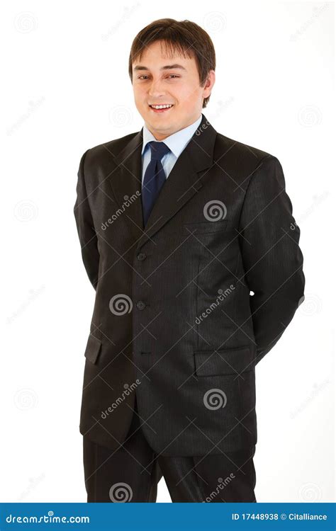 Smiling Young Businessman With Hands Behind Back Stock Photo Image Of