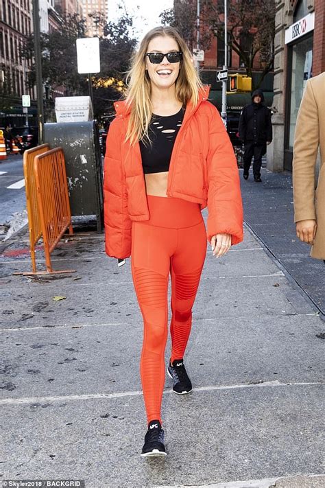 Nina Agdal Flashes Her Toned Abs In Sports Bra With Orange Leggings And Jacket With Beau Jack