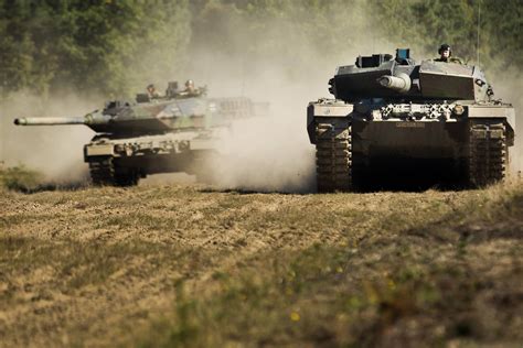 Royal Netherlands Army Crew Driving German Leopard 2a6 Tanks During