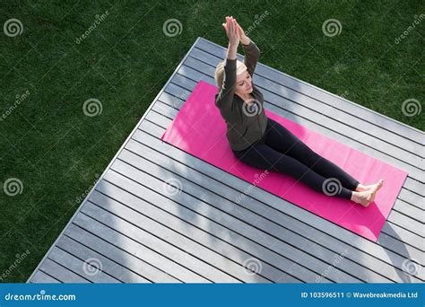Overhead Of Woman Practicing Yoga In Porch Stock Image Image Of Mature Meditating 103596511