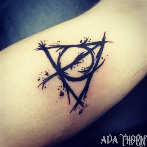This one looks highly elegant when carried somewhat as shown in the image. Deathly Hallows Tattoo explained - 100+ Deathly Hallows ...