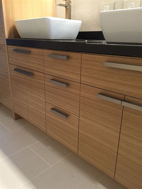 Crafted from solid rubberwood, the unit features angled legs, a drawer and storage shelf for towels and toiletries. Grain matched rift-sawn white oak vanity | Master bath remodel, Custom modern furniture, Bath ...