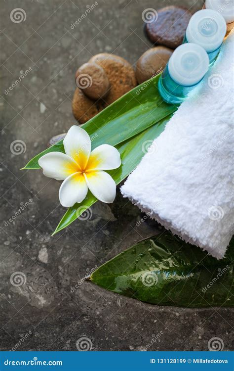 Tropical Flower On Leavestowel And Cream Tube For Massage Stock Image Image Of Pampering