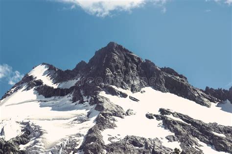 The Top Of The Mountain On The Background Of Blue Sky Stock Photo