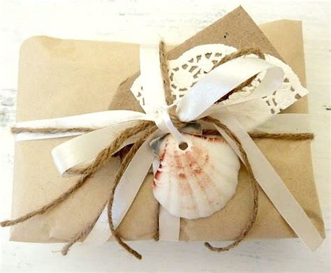 Who ever thought brown paper could look so pretty? Simple Beachy Gift Wrapping Ideas with Shells, Brown Paper ...